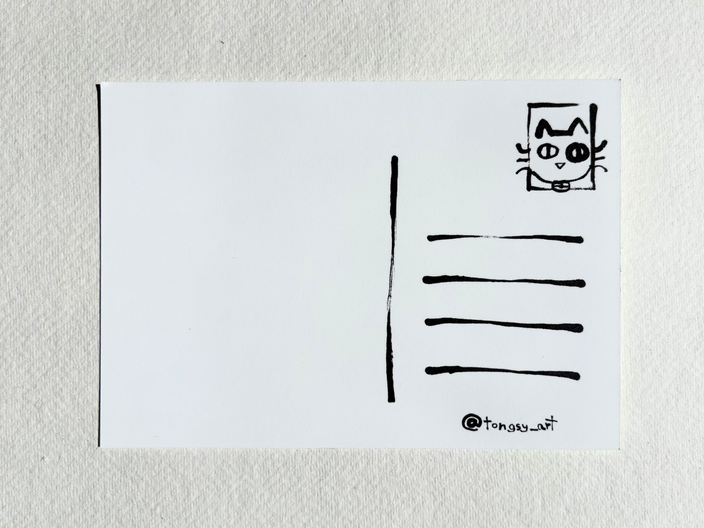 Back of a post card with ink illustration and line