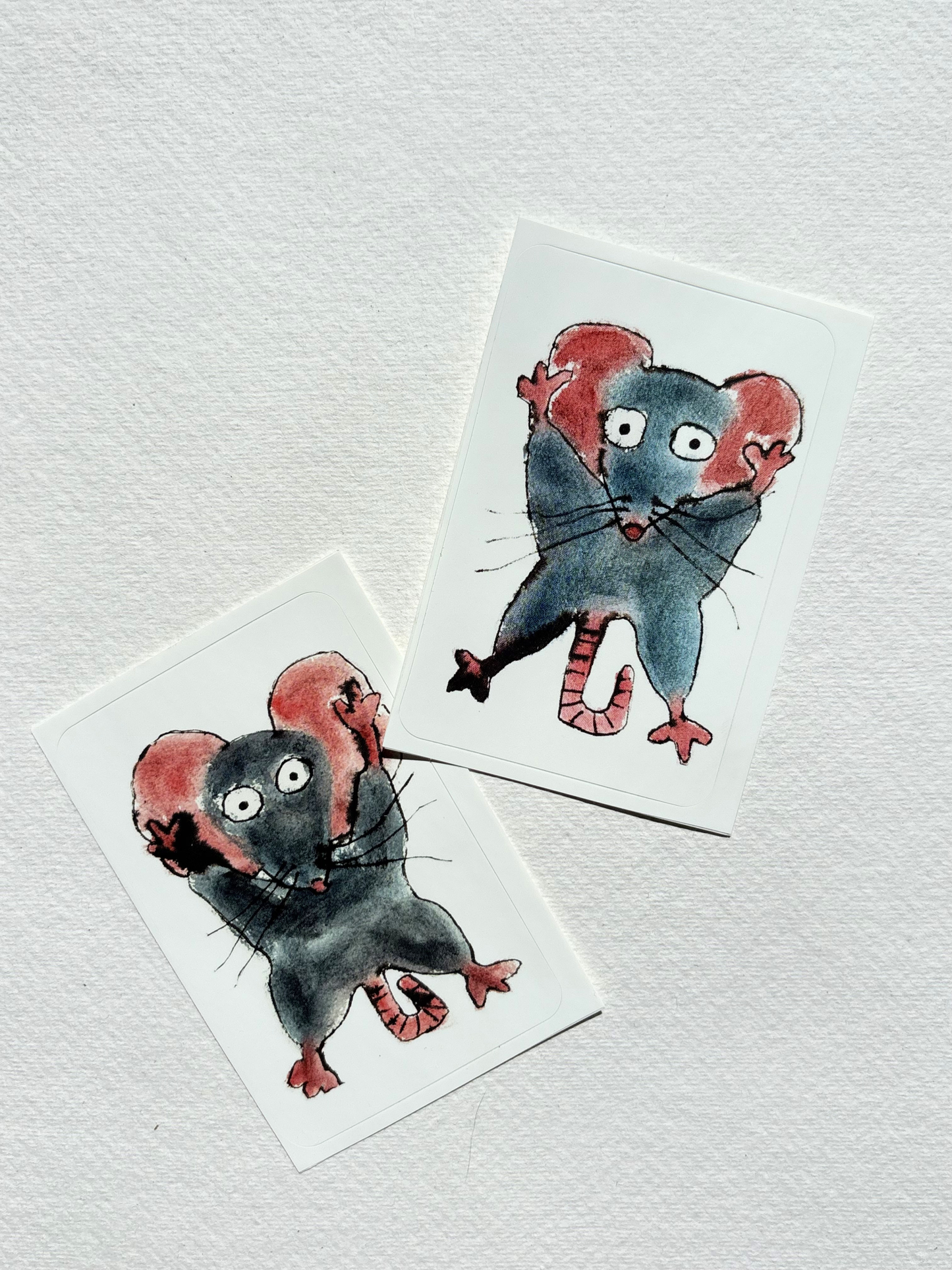 sticker featuring a hand draw vivid watercolour illustration of a cartoon mouse.