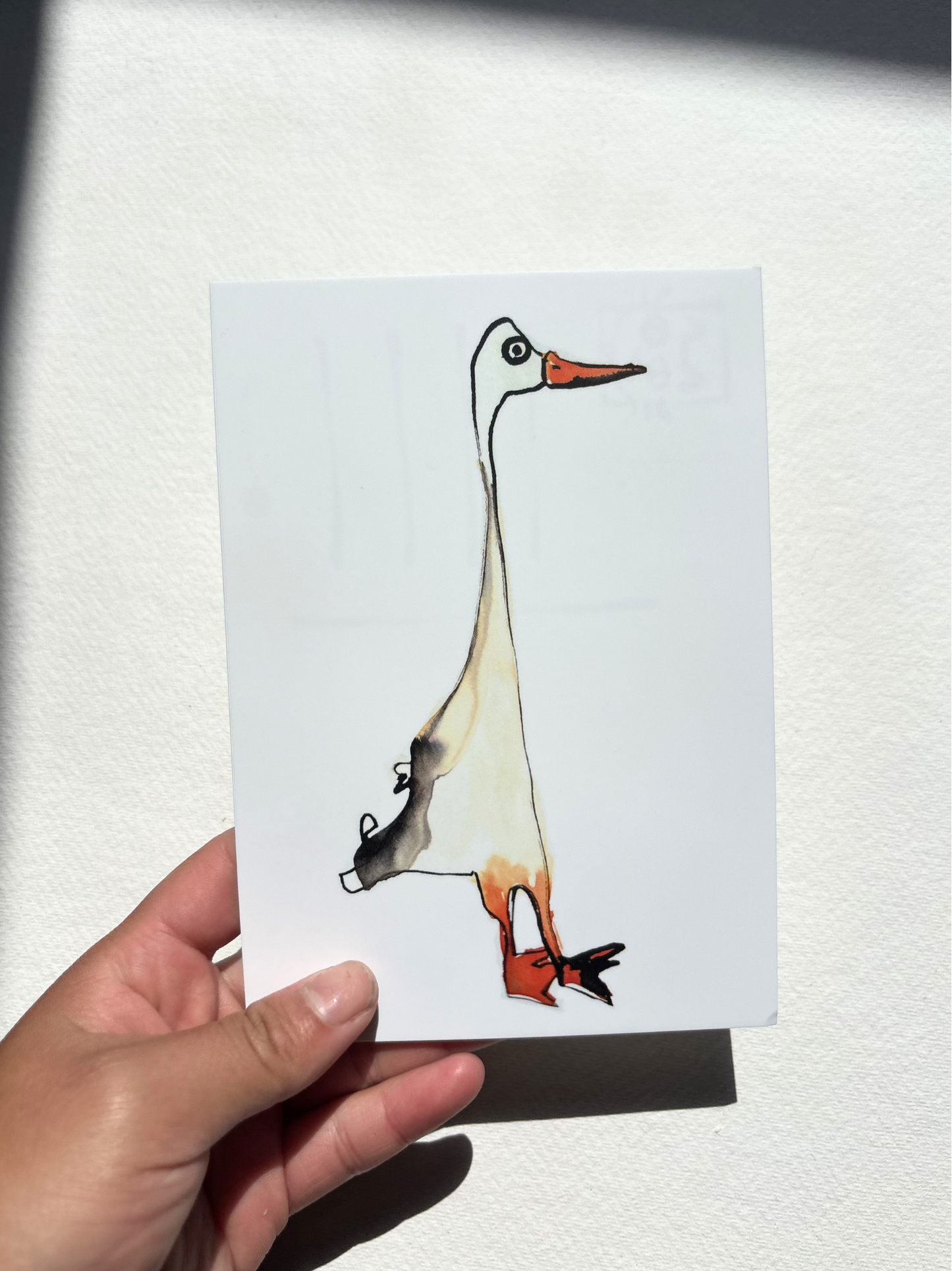  A6 postcard featuring a hand draw vivid watercolour illustration of a cartoon Duck.