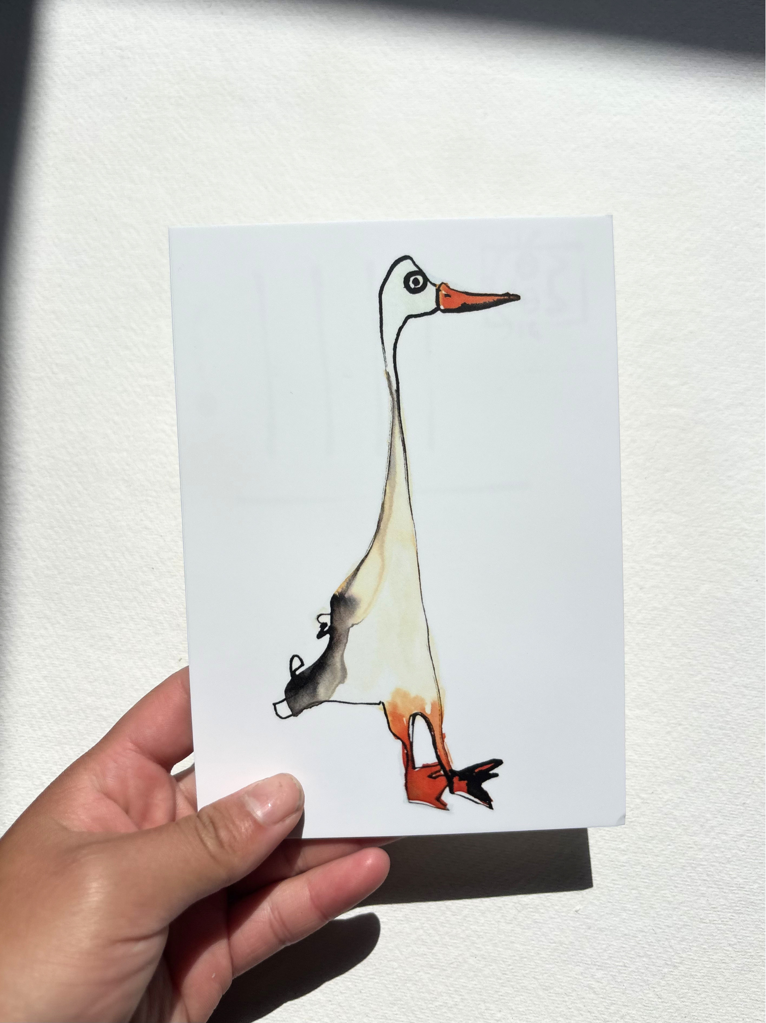  A6 postcard featuring a hand draw vivid watercolour illustration of a cartoon Duck.